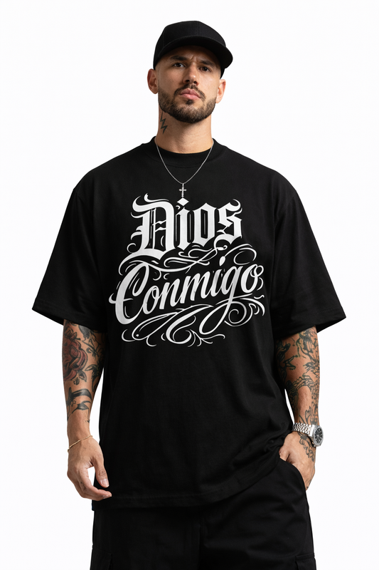 Man wearing oversized black “Dios Conmigo” t-shirt on clean white background premium streetwear by Ke Chingon